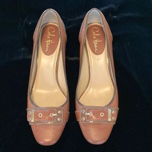 Never worn brown leather heels with buckle design.